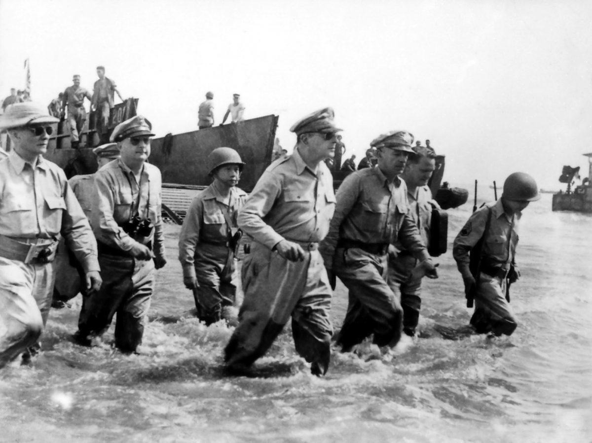 MacArthur wades ashore during initial landings at Leyte, Philippine Islands, in October 1944. (Public Domain)
