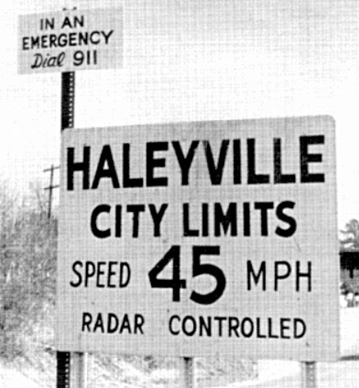 "In an emergency dial 911" explains Haleyville's proud road sign. The small city is where our nationally recognized emergency number first began. (Courtesy of Haleyville City Hall)