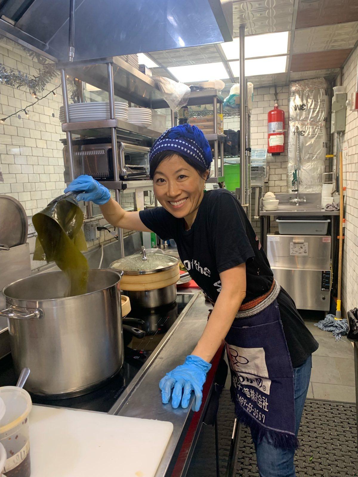 Yumiko Komatsudaira, who goes by "Nonna Yumi," cooks in the kitchen at Enoteca Maria. (Courtesy of Enoteca Maria)