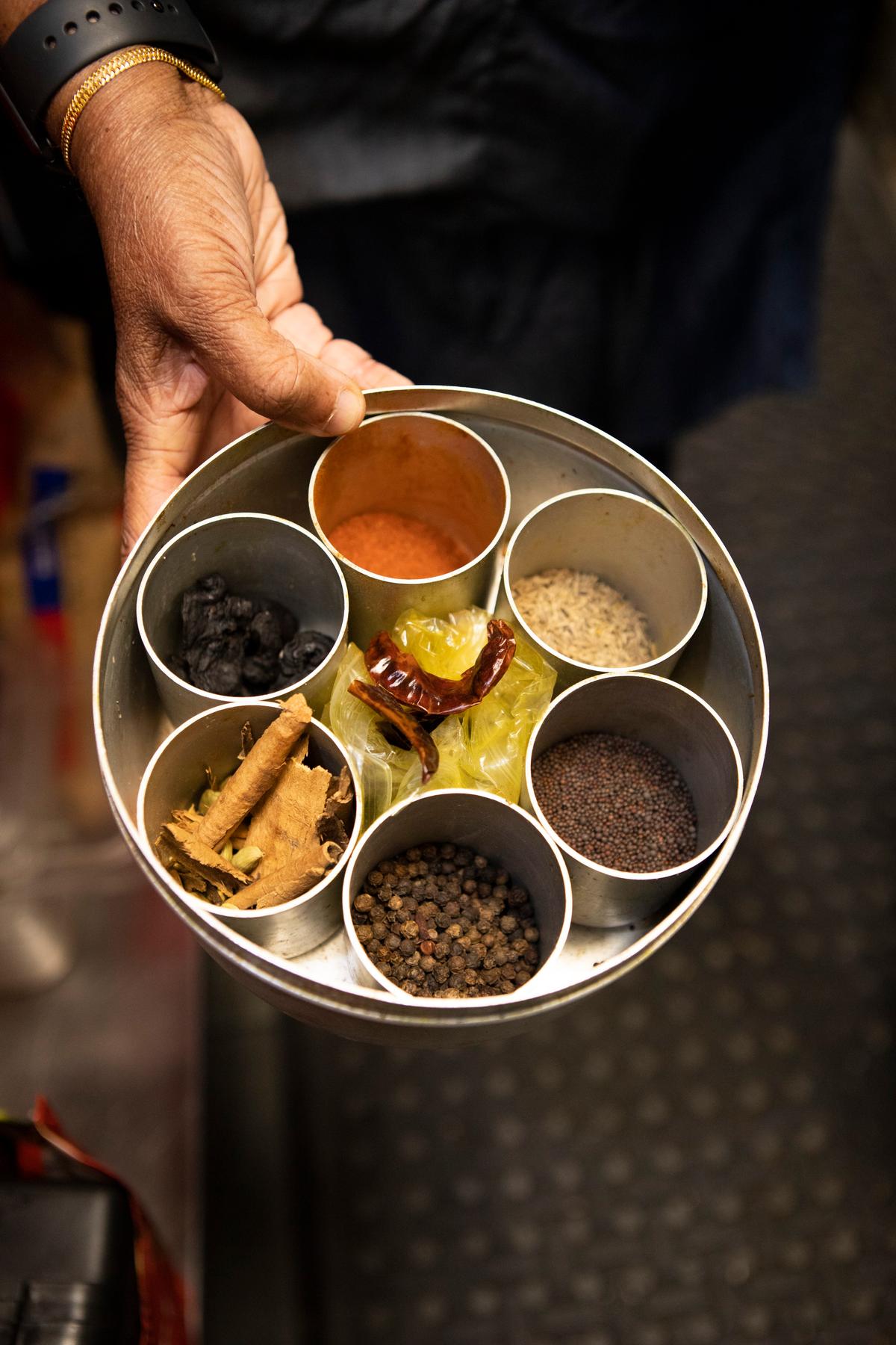 A tin of spices belonging to Nonna Dolly, who cooks Sri Lankan specialties with ingredients sourced locally and brought from visits to her home country. (Adhiraj Chakrabarti)