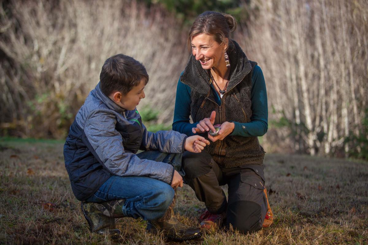 Apelian applies an herbal salve on her son, Quinn. (Courtesy of Nicole Apelian)