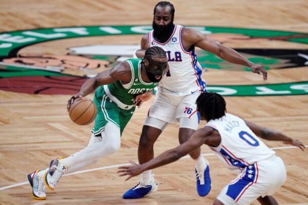 <br/>Boston Celtics guard Jaylen Brown (L), drives between Philadelphia 76ers' James Harden and Tyrese Maxey (0) during the first half of Game 2 in the NBA basketball Eastern Conference semifinals playoff series, in Boston on May 3, 2023. (Charles Krupa/AP Photo)