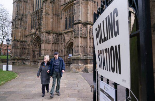 Voters leave a polling station in Bridlington Priory Church, Yorkshire, England, on May 4, 2023. (Danny Lawson/PA Media)