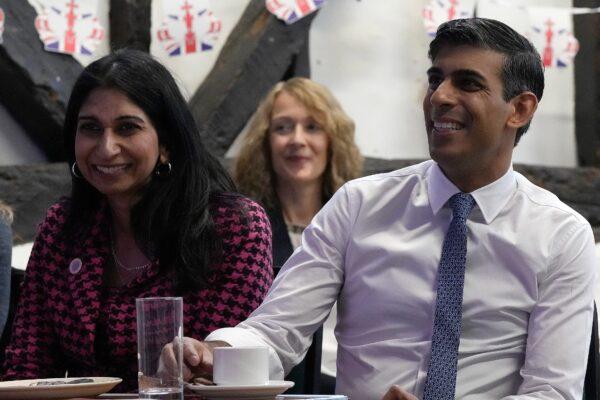 Prime Minister Rishi Sunak and then-Home Secretary Suella Braverman listen as they visit a U3A community group at the Chiltern Leisure Centre in Amersham, Buckinghamshire, on May 3, 2023. (Frank Augstein/PA Media)