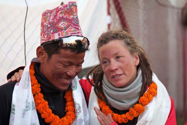 Norwegian climber Kristin Harila, 37 (R), speaks to her guide Tenjen Sherpa after arriving in Kathmandu, Nepal, on May 4, 2023. (Niranjan Shrestha/AP Photo)