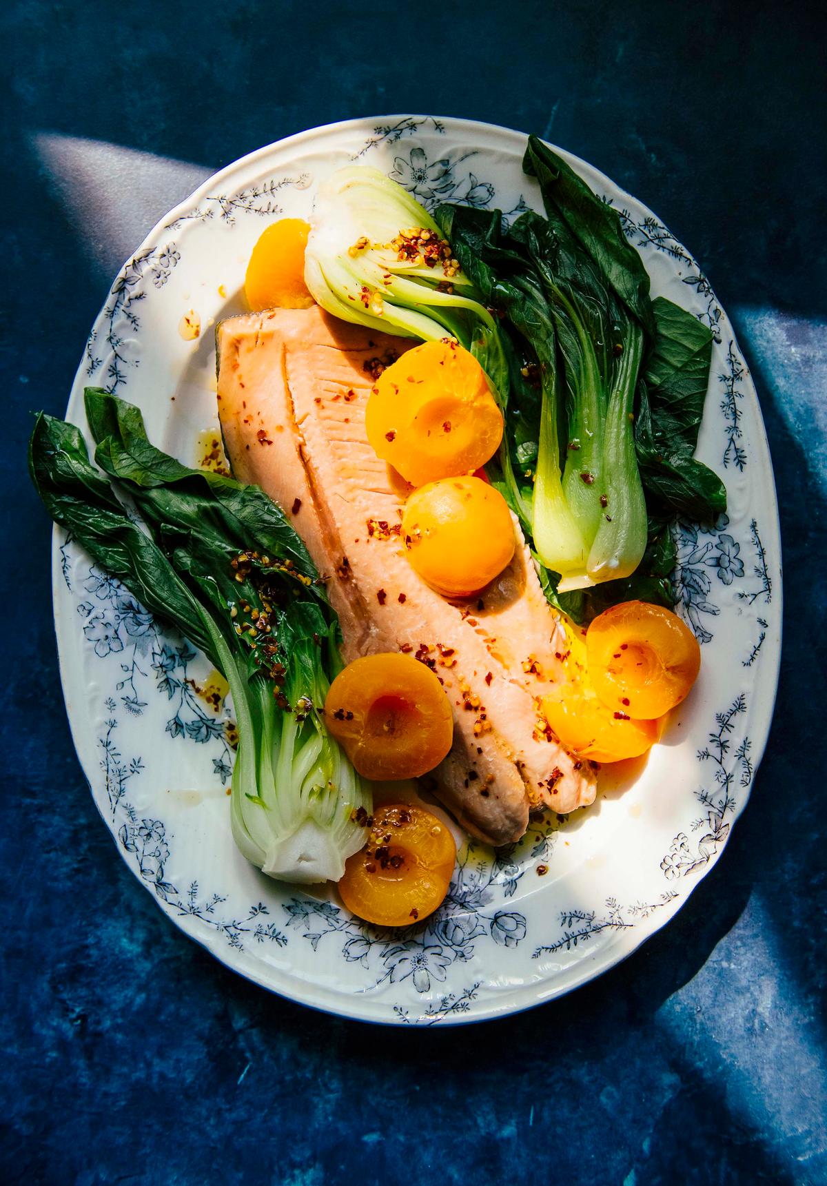 Ginger-poached apricots pair unexpectedly well with bok choy and chile oil. (EE Berger)