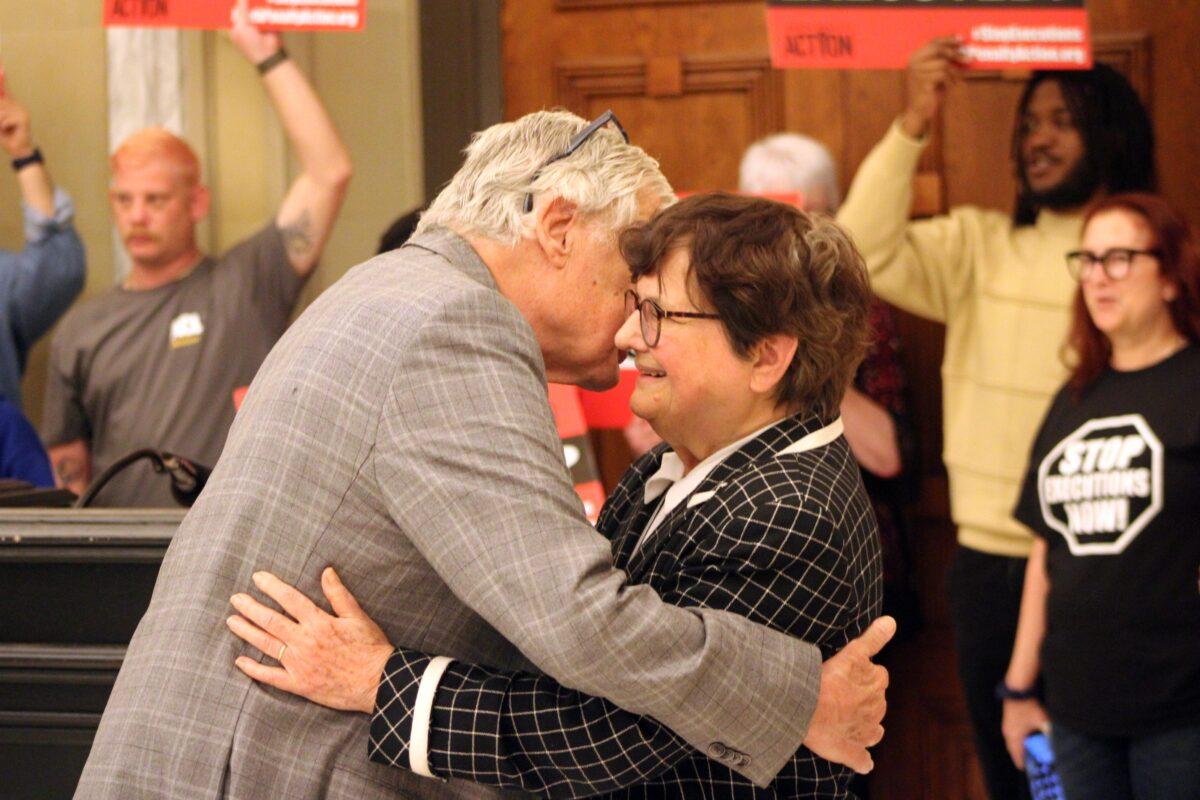 Death penalty abolitionist Sister Helen Prejean is greeted by a supporter during a demonstration in the Oklahoma capitol building, on May 4, 2023. (Michael Clements/The Epoch Times)