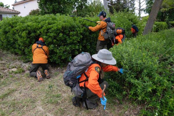 Volunteers from the Yolo County Search and Rescue Team look for evidence from the stabbing murder of Karim Abou Najm near Sycamore Park in Davis, Calif., on, May 1, 2023. (Paul Kitagaki Jr./The Sacramento Bee via AP)