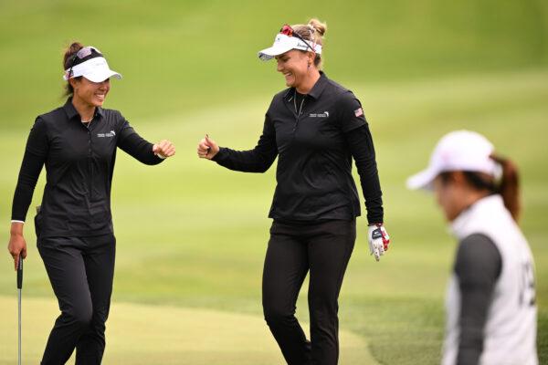 Danielle Kang (L) and Lexi Thompson (R) of Team United States fist bump after a shot on the tenth hole during day one of the Hanwha LIFEPLUS International Crown at TPC Harding Park in San Francisco on May 4, 2023. (Orlando Ramirez/Getty Images)