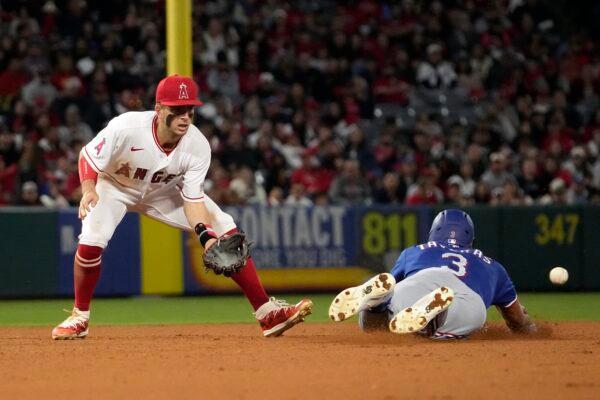 Texas Rangers' Leody Taveras (R) dives into second for a double as Los Angeles Angels shortstop Zach Neto takes a late throw during the fifth inning of a baseball game in Anaheim, Calif., on May 5, 2023. (Mark J. Terrill/AP Photo)