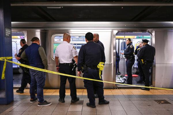 New York police officers respond to the scene where a fight was reported on a subway train in New York on May 1, 2023. (Paul Martinka via AP)