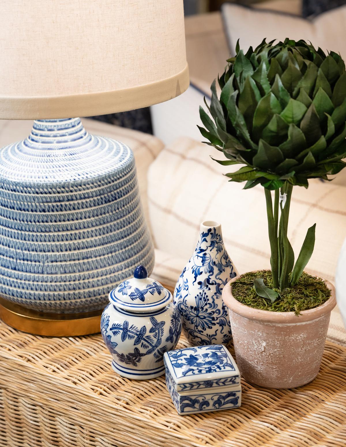 Small blue and white trinket boxes add new traditional elegance to a console table. (Handout/TNS)