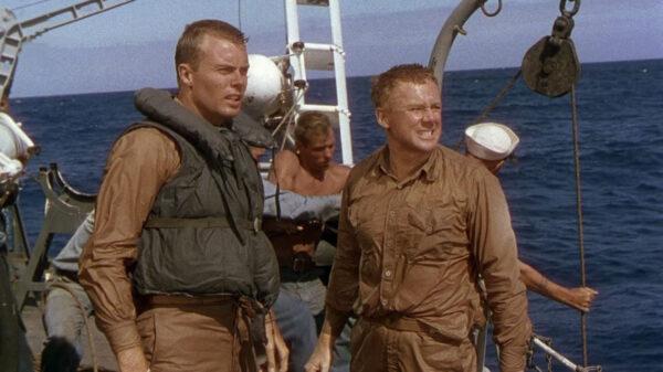 Ens. Willie Keith (Robert Francis, L) and Lt. Steve Maryk (Van Johnson) begin to wonder about their commander’s bizarre behavior, in “The Caine Mutiny.” (Columbia Pictures)