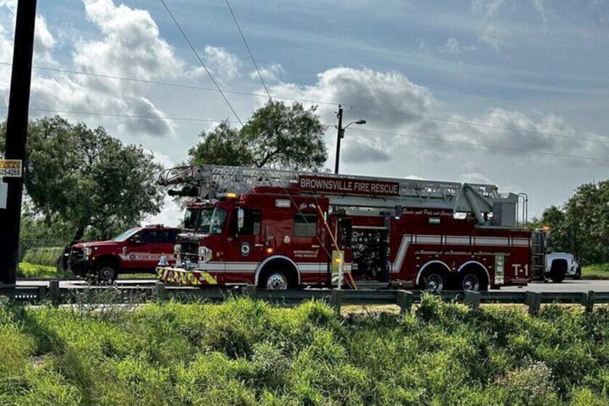 Emergency personnel work at the site of a fatal vehicular collision at a bus stop in Brownsville, Texas, on May 7, 2023. (Brian Svendsen/NewsNation/KVEO-TV via AP)