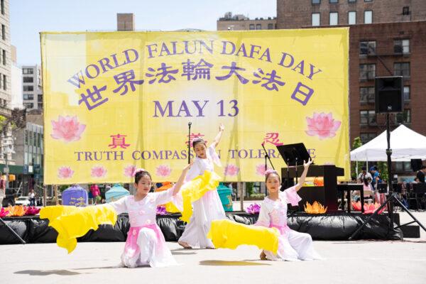 Falun Gong practitioners celebrate World Falun Dafa Day in New York City on May 7, 2023. (Larry Dye/The Epoch Times)