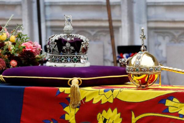 The coffin of Queen Elizabeth II with the Imperial State Crown, Orb and Sceptre resting on top is carried into Westminster Abbey in London, England, on Sept. 19, 2022. (Tristan Fewings/Getty Images)