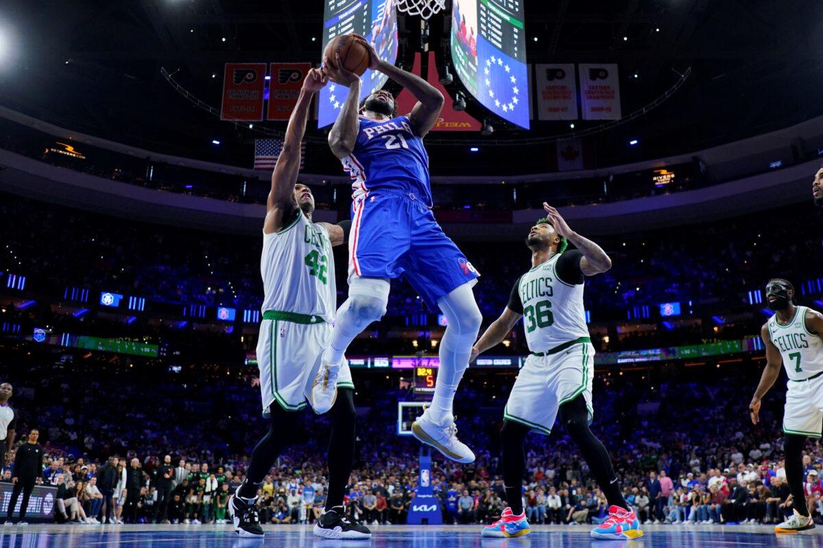 Philadelphia 76ers' Joel Embiid (21) goes up to shoot against Boston Celtics' Al Horford (L), and Marcus Smart during the second half of Game 4 in an NBA basketball Eastern Conference semifinals playoff series in Philadelphia on May 7, 2023. (Matt Slocum/AP Photo)
