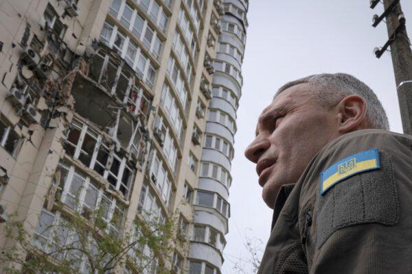 Kyiv's Mayor Vitali Klitschko stands in front of an apartment building damaged by a drone shot down during a Russian overnight strike in Kyiv on May 8, 2023. (Andrew Kravchenko/AP Photo)