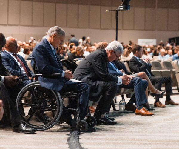 Texas Gov. Greg Abbott (front) and Lt. Gov. Dan Patrick on May 7, 2023, attended a prayer vigil for the eight victims killed and seven others injured when an attacker opened fire at Allen Premium Outlets in Allen, Texas, on May 6, 2023. (Courtesy of the office of Greg Abbott)