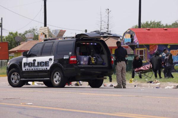 Emergency personnel respond to a fatal crash in Brownsville, Texas, on May 7, 2023. (Michael Gonzalez/AP Photo)