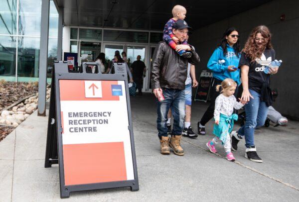 Alberta wildfire evacuees get supplies and get checked in at the evacuation centre in Edmonton on May 7, 2023. (Jason Franson/The Canadian Press)