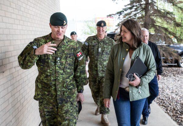 Alberta Premier Danielle Smith meets with members of the military in Edmonton who are on standby to help with the wildfires before she gives an update on the situation in Alberta on May 8, 2023. (Jason Franson/The Canadian Press)