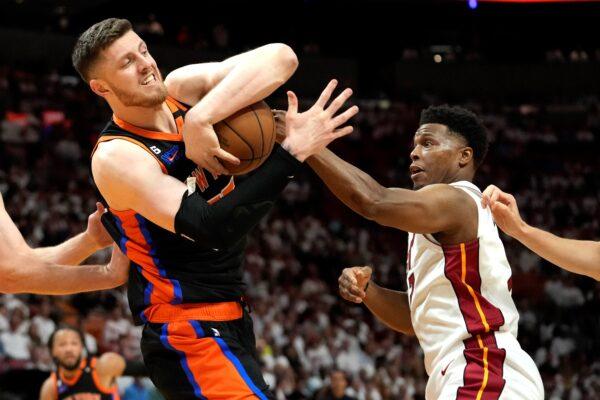 New York Knicks center Isaiah Hartenstein (L), fights for control of the ball as Miami Heat guard Kyle Lowry defends during the first half of Game 4 of the NBA basketball Eastern Conference playoff semifinal in Miami on May 8, 2023. (Lynne Sladky/AP Photo)
