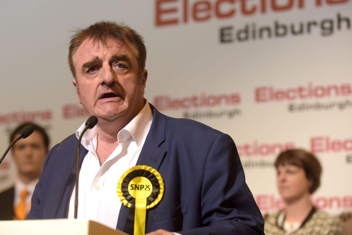 Tommy Sheppard, Scottish National Party member of Parliament for Edinburgh East, speaks after winning the seat at the Meadowbank Sports Centre counting centre in Edinburgh, early in the morning of June 9, 2017. (Lesley Martin/AFP via Getty Images)
