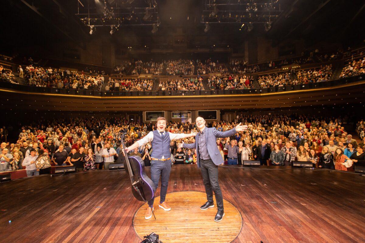 Steven Sharp Nelson (L) and Jon Schmidt at a concert at the Grand Ole Opry in Nashville, Tenn., on Nov. 30, 2022. (Courtesy of The Piano Guys)