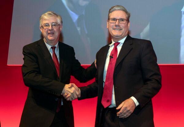 First Minister of Wales and Leader of the Welsh Labour Mark Drakeford shakes hands with UK Labour leader Sir Keir Starmer at the Welsh Labour Conference at Venue Cymru, in Llandudno, Wales, on March 11, 2023. (Jason Roberts/Getty Images)