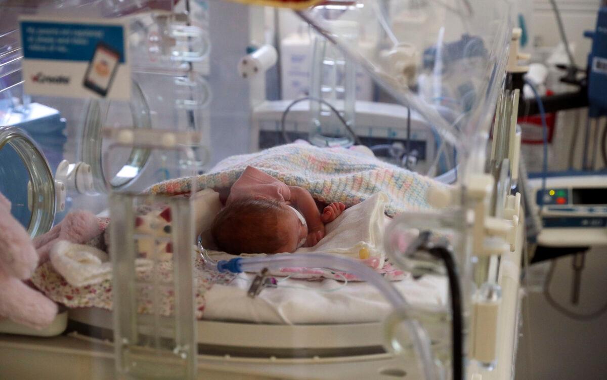 A newborn baby in the maternity ward at Frimley Park Hospital in Surrey, United Kingdom, on May 22, 2020. (Steve Parsons/Getty Images)