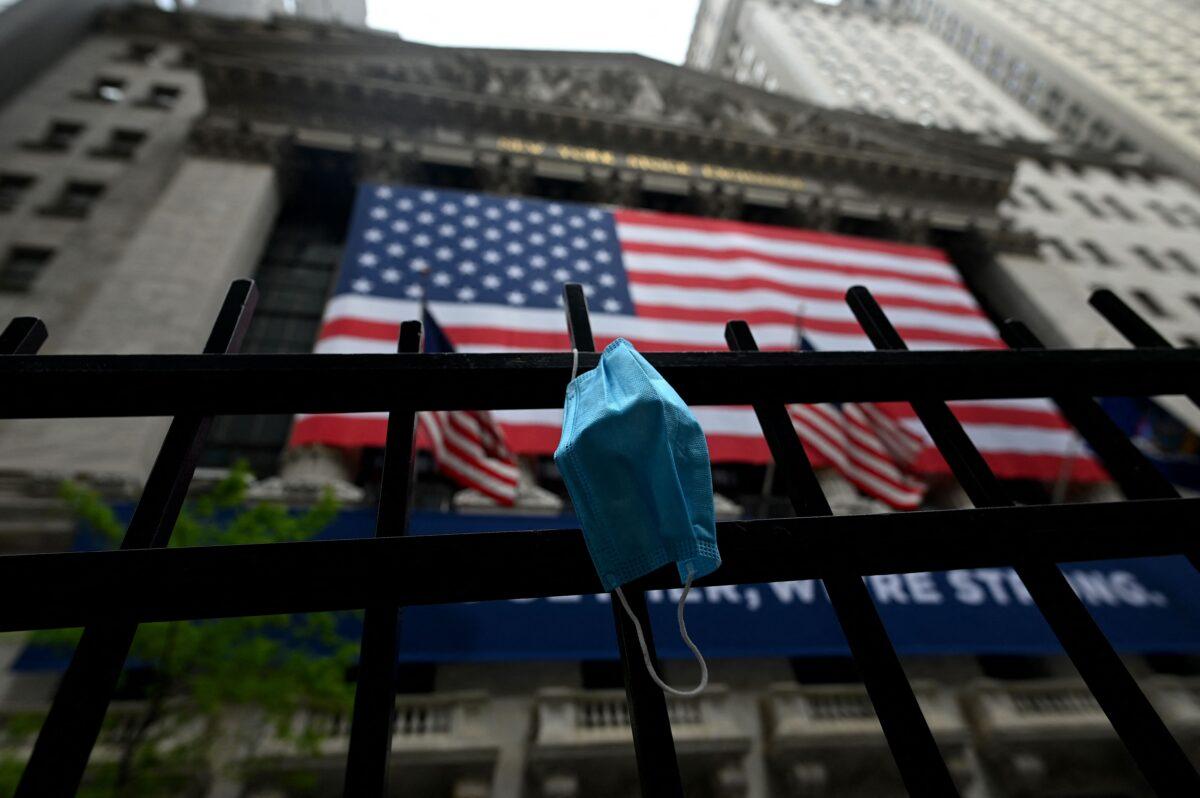 A face mask is seen in front of the New York Stock Exchange on May 26, 2020. (Johannes Eisele/AFP via Getty Images)