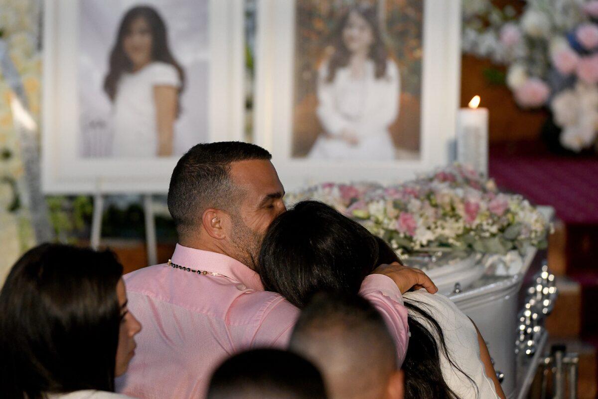 Danny Abdallah and Leila Abdallah are seen during the funeral for their children Antony, 13, Angelina, 12, and Sienna, 8, at Our Lady of Lebanon Co-Cathedral in Sydney, Australia, on Feb. 10, 2020. (AAP Image/Bianca De Marchi)