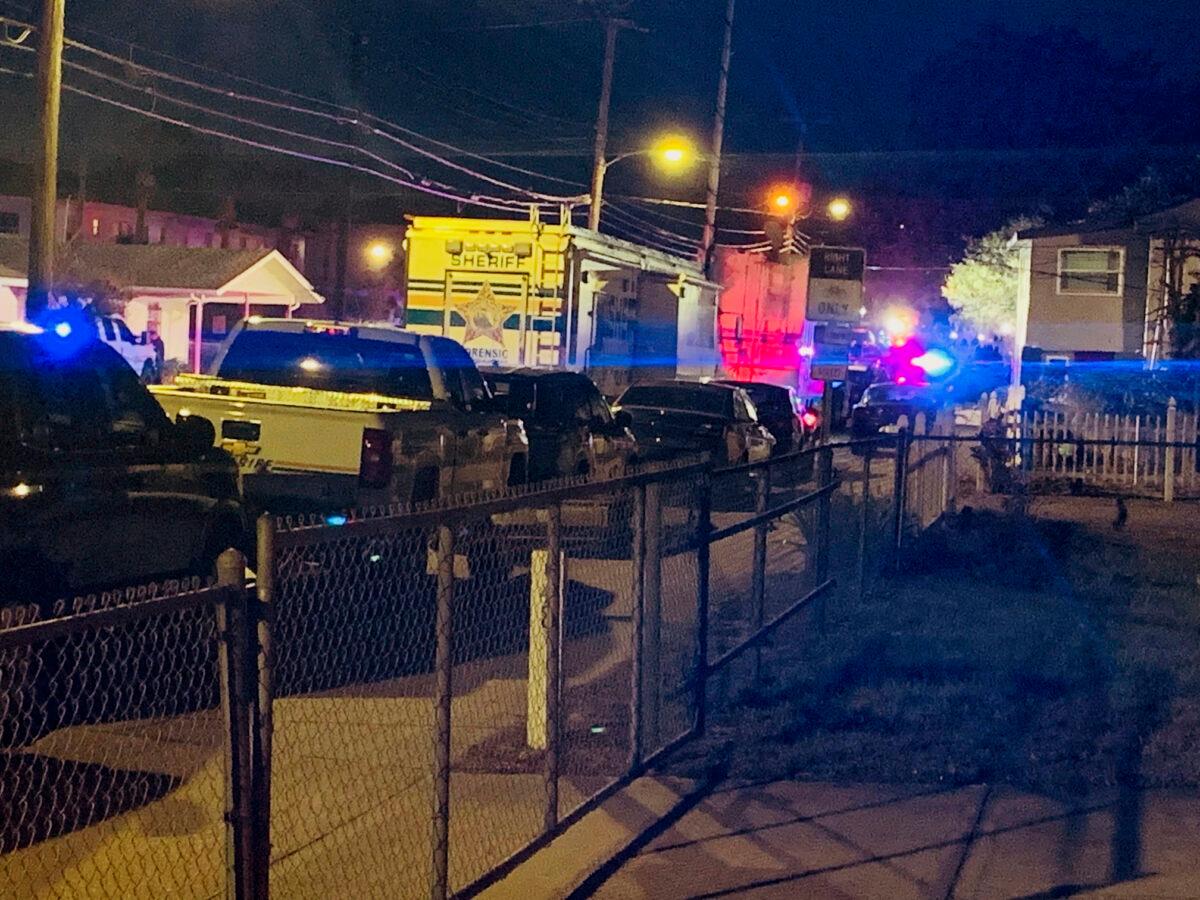 Units from the Lakeland Police Department and Polk County Sheriff's Office line 10th Street in Lakeland, Fla., on May 10, 2023 evening after a shooting incident that wounded a Lakeland police officer and a juvenile. (Sara Megan Walsh/The Ledger via AP)