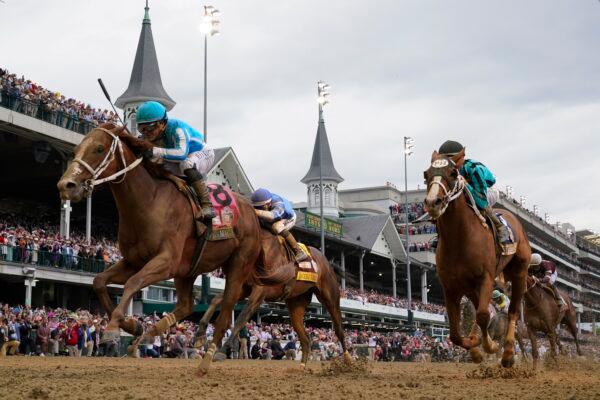 Mage (8), with Javier Castellano aboard, wins the 149th running of the Kentucky Derby horse race at Churchill Downs in Louisville, Ky., on May 6, 2023. (Jeff Roberson/AP Photo)