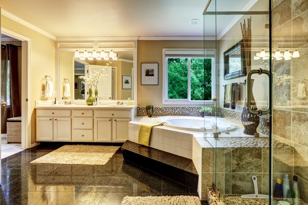 The bathroom is a great place to start a home spa transformation, making it a place to recharge and refresh with a soaking tub, walk-in shower, and thick, luxurious towels. (Artazum/Shutterstock)