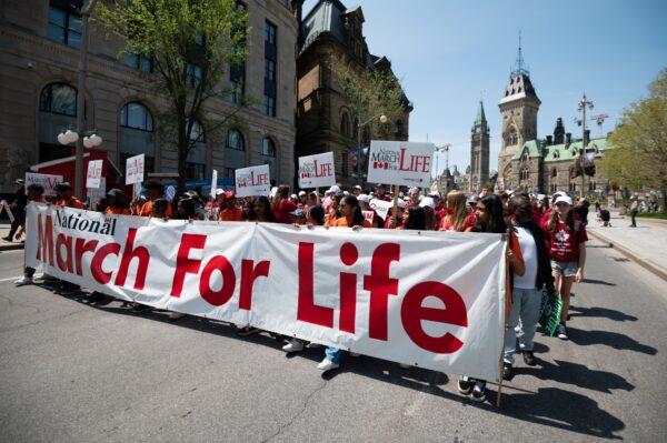 Demonstrators take part in the March for Life event in Ottawa on May 11, 2023. (The Canadian Press/Spencer Colby)