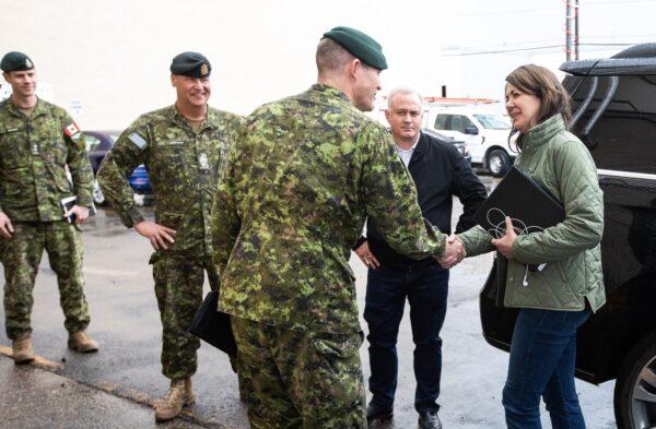 Alberta Premier Danielle Smith meets with members of the military in Edmonton, who are on standby to help with the wildfires, before she gave an update on the situation in the province on May 8, 2023. (The Canadian Press/Jason Franson)