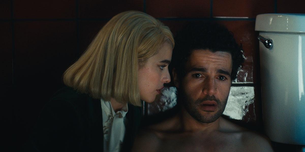 Rebecca (Margaret Qualley) and Hal (Christopher Abbott), in "Sanctuary." (Rumble Films/Neon)