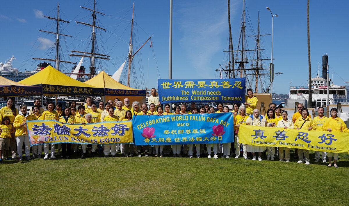Members of the spiritual practice Falun Dafa gather to celebrate World Falun Dafa Day at the San Diego County Administration building in Downtown San Diego on May 7, 2023. (Jane Yang/The Epoch Times)