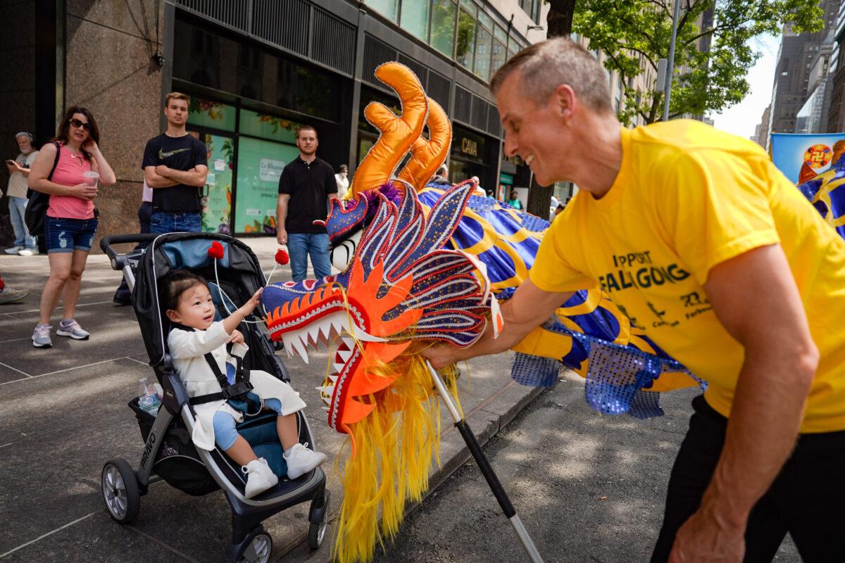 Falun Gong practitioners march in Manhattan to celebrate World Falun Dafa Day on May 12, 2023. (Samira Bouaou/The Epoch Times)