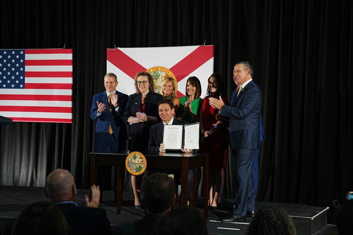 Florida Gov. Ron DeSantis signs legislation banning the financial industry's use of ESG principles on May 2. (Courtesy of the Florida Governor's Office)