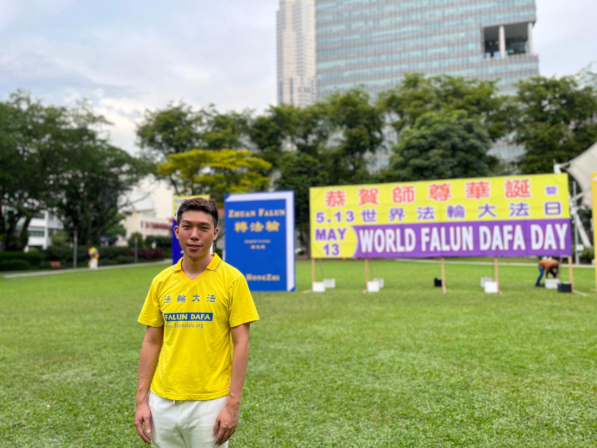 Jin Ang, 38, participates in the celebration of World Falun Dafa Day in Singapore on May 5, 2023. (Jocelyn Neo/The Epoch Times)
