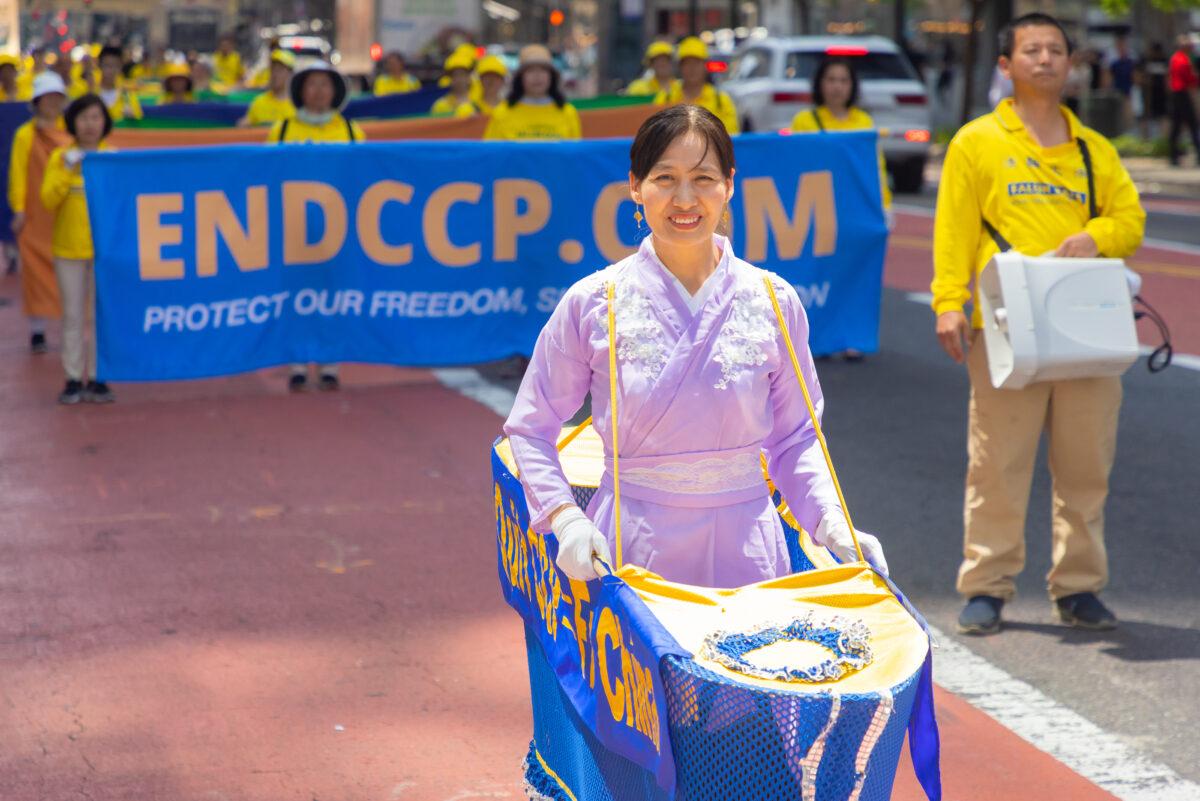 Falun Gong practitioners march in Manhattan to celebrate World Falun Dafa Day on May 12, 2023. (Mark Zou/The Epoch Times)