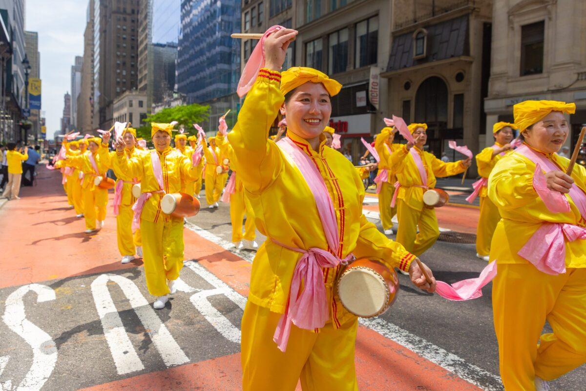 Falun Gong practitioners march in New York City to celebrate World Falun Dafa Day on May 12, 2023. (Mark Zou/The Epoch Times)