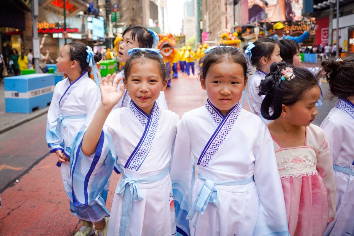 Falun Gong practitioners march in Manhattan to celebrate World Falun Dafa Day on May 12, 2023. (Samira Bouaou/The Epoch Times)