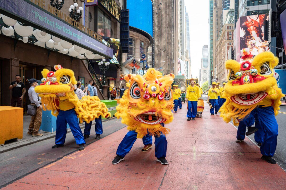 Falun Gong practitioners march in Manhattan to celebrate World Falun Dafa Day on May 12, 2023. (Samira Bouaou/The Epoch Times)