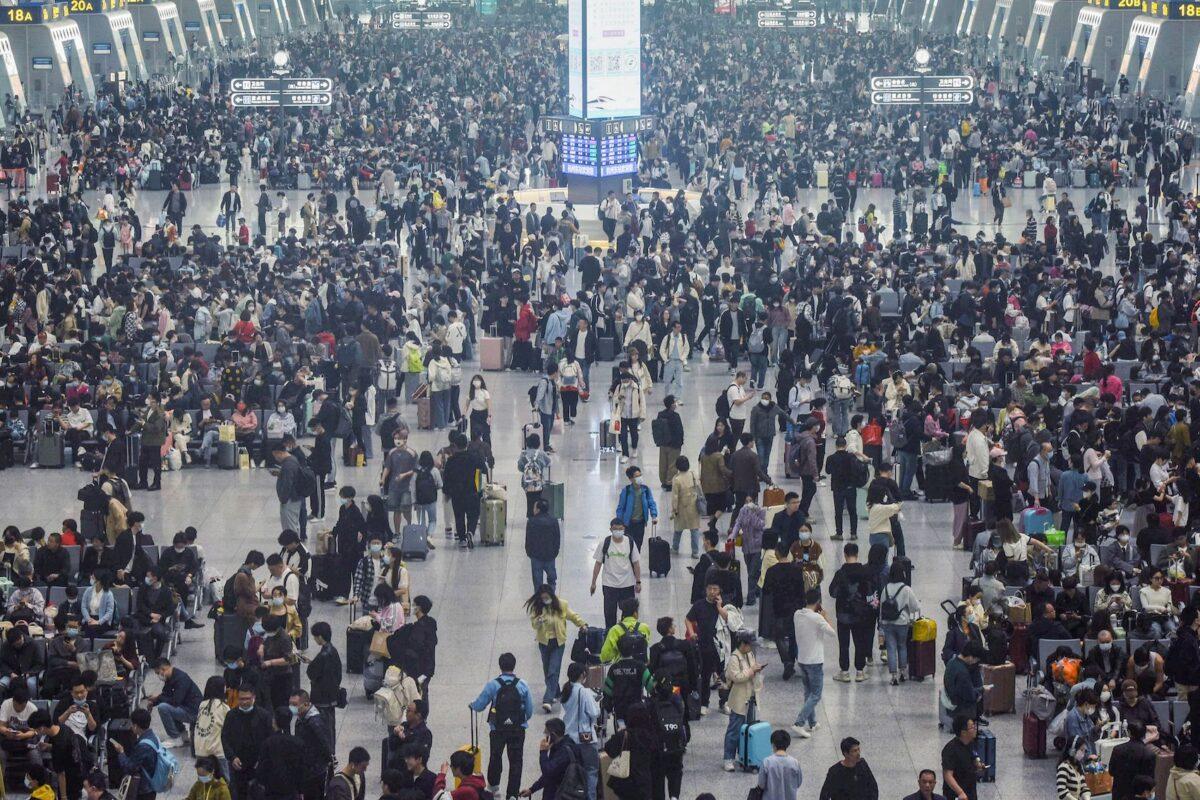 Passengers arrive at Hangzhou East train station in Hangzhou, in China's eastern Zhejiang Province on April 28, 2023, ahead of the Labor Day holiday, which started on April 29. (STR/AFP via Getty Images)