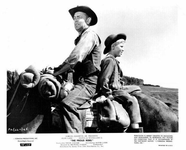 John Chandler (Alan Ladd) and his son David (David Ladd) come to Illinois, in "The Proud Rebel." Samuel L. Goldwyn)