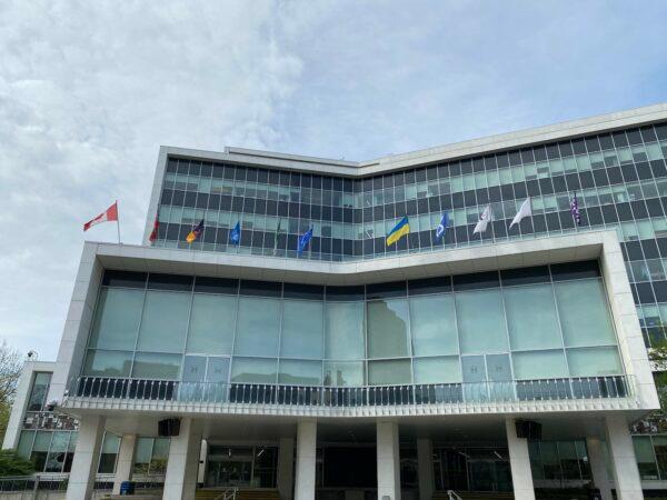 A Falun Dafa flag flies outside city hall in Hamilton, Ont., on May 11, 2023. (Courtesy of Falun Dafa Association of Canada)